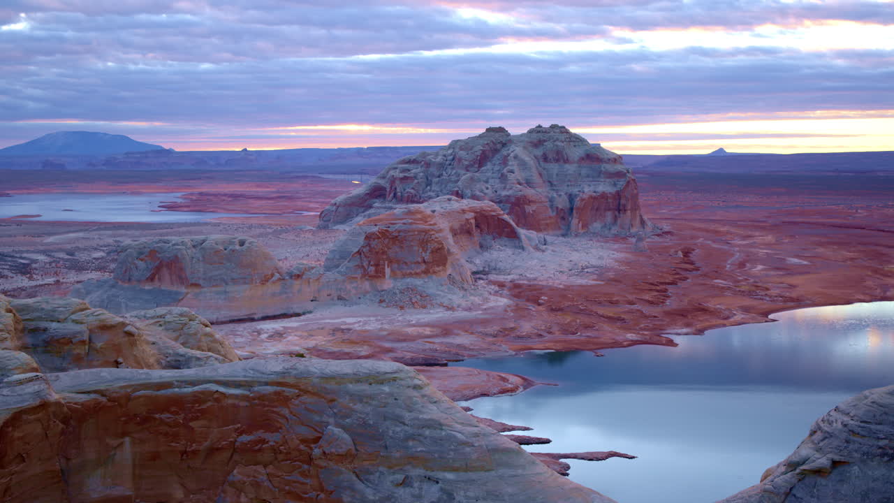 Aerial footage captures Glen Canyon’s mesmerizing sandstone formations and the vast waters stretching beyond.