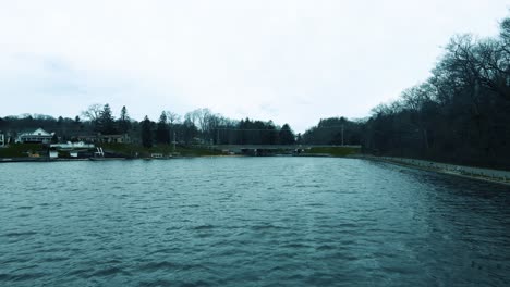 westward approach with drone toward the local lake harbor park