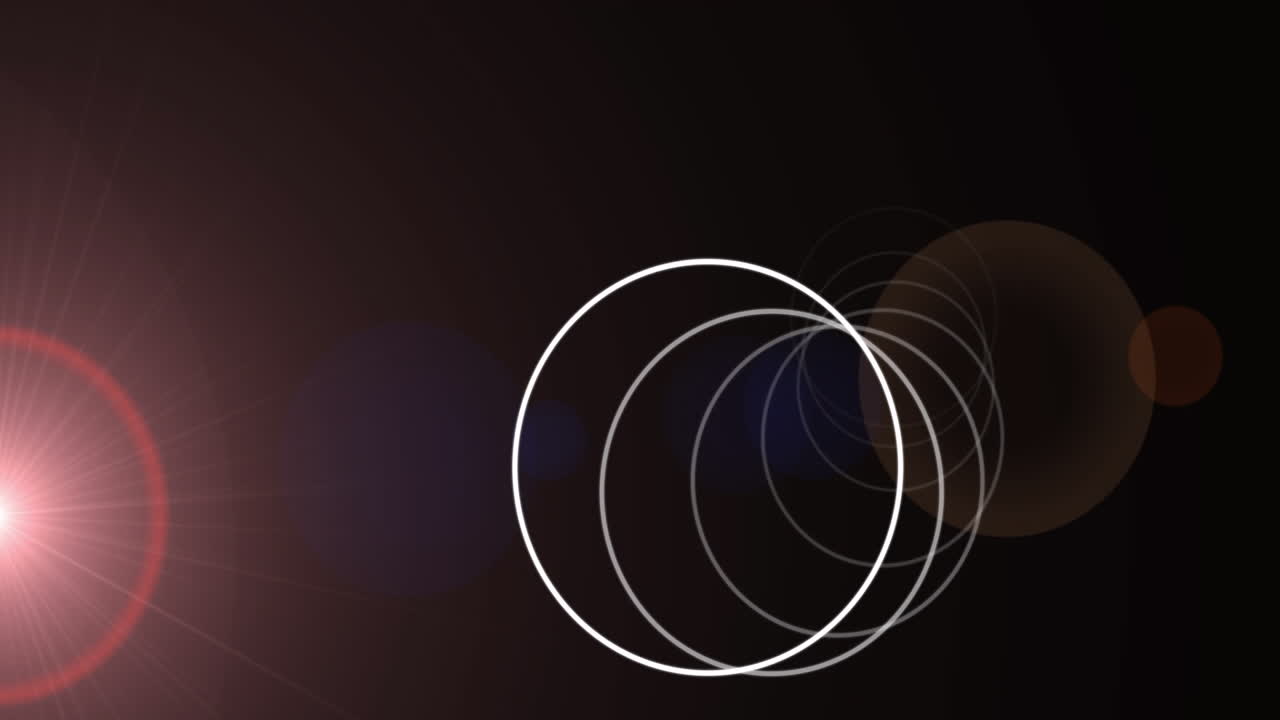 검은 바탕에 있는 밝은 반점 위에 있는  ⁇ 색 원의 애니메이션