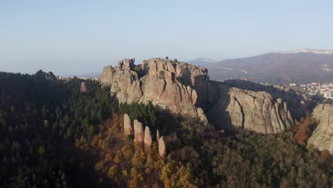 Zipline-aerial-drone-shot-of-the-natural-sculptural-rock-formations-of-Belogradchik-cliffs,-situated-in-the-province-of-Vidin-in-Northwesten-Bulgaria