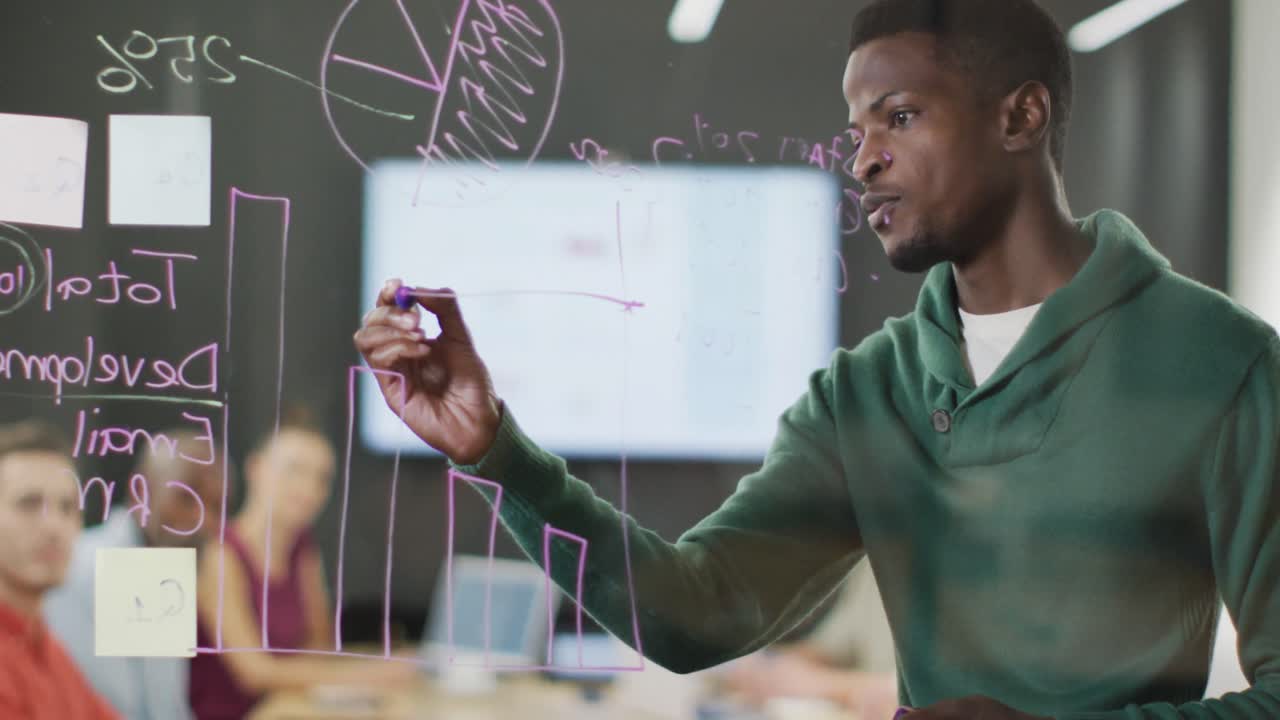 Happy diverse business people discussing work during meeting at office