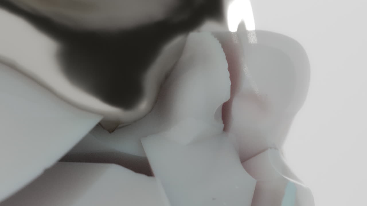 A silver liquid metal flows slowly on the sculpture