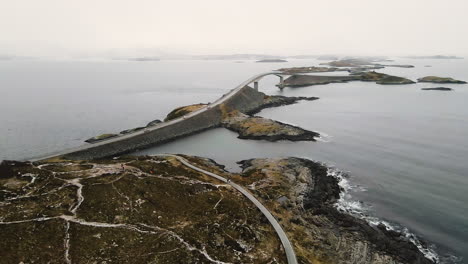 storseisundet bridge and atlantic ocean road during snowfall in norway