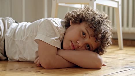boy lying on the floor