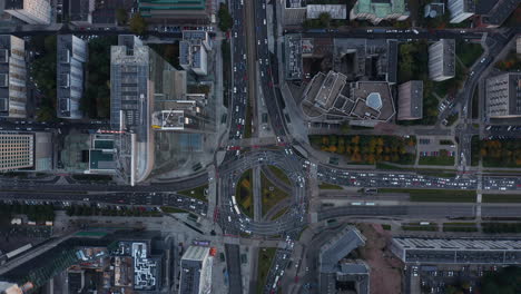 Aerial-birds-eye-overhead-top-down-panning-view-of-traffic-jam-around-large-roundabout-in-city-centre.-Warsaw,-Poland