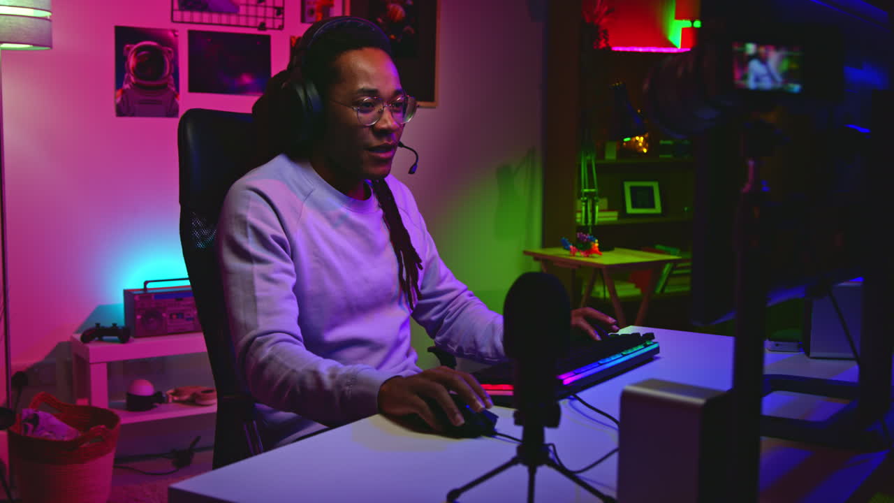 Man Playing Video Games at His Computer Desk