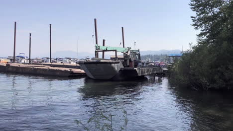 a utility boat parked near a lake tahoe marina