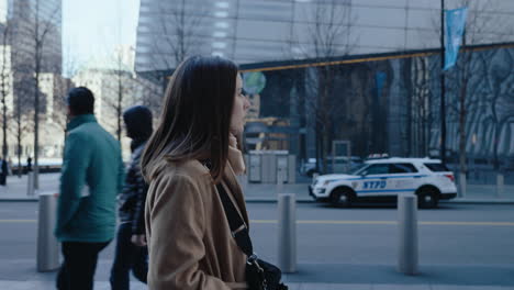 woman walking in downtown new york city