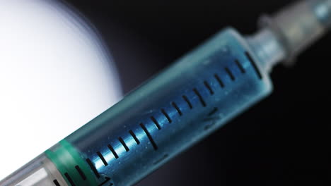 handheld close up of syringe