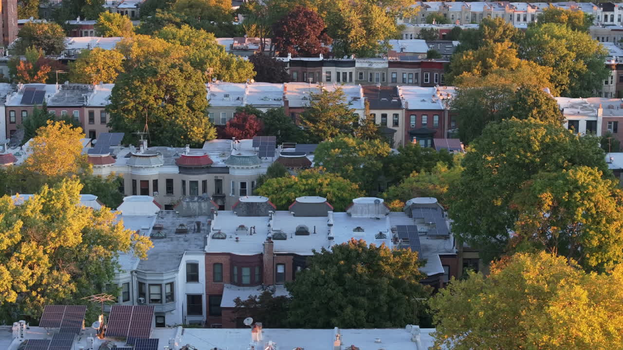 Aerial View of a Residential Neighborhood with Solar Panels on Autumn Day