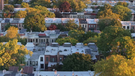 aerial view of a residential neighborhood with solar panels on autumn day
