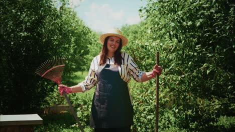 smiling woman gardener working in a garden
