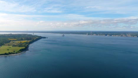 Aerial-View-Of-Chacao-channel-With-Construction-Of-Bridge-Between-Mainland-And-Big-Island-of-Chiloe-In-background