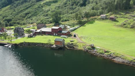 a farm on the shore of the naeroyfjord