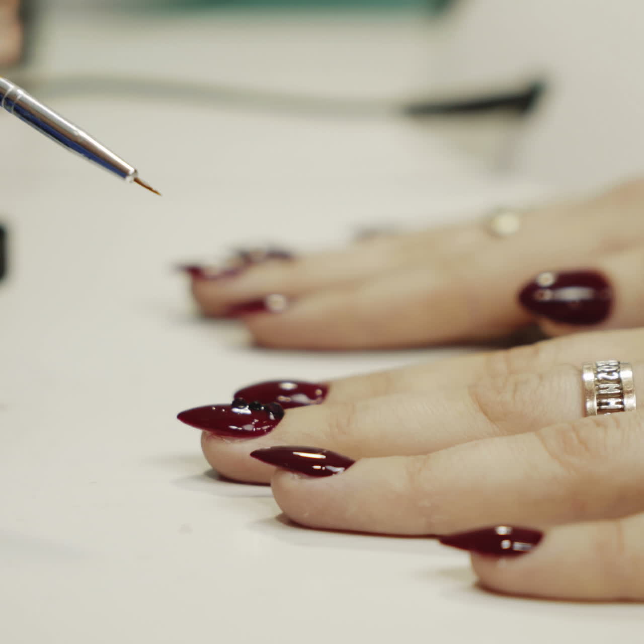 Woman getting her nails done in a salon