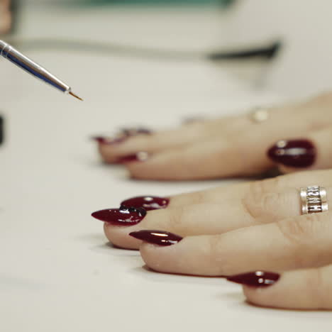 woman getting her nails done in a salon