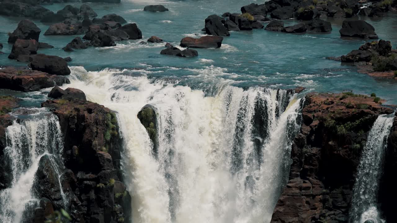 Close Up View Of Water Cascading Down On Iguazu Waterfalls In Brazil And Argentina