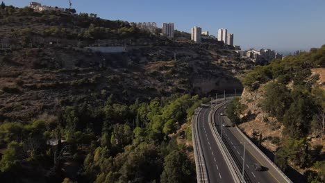 aerial view of highway through city valley