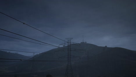 power lines over mountains at dusk