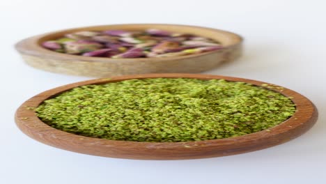 ground pistachios in a wooden bowl