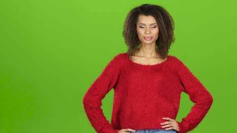woman in red sweater pointing