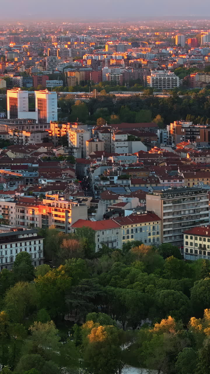Aerial drone view of Sempione park in Milan, Italy on a sunny day. Vertical