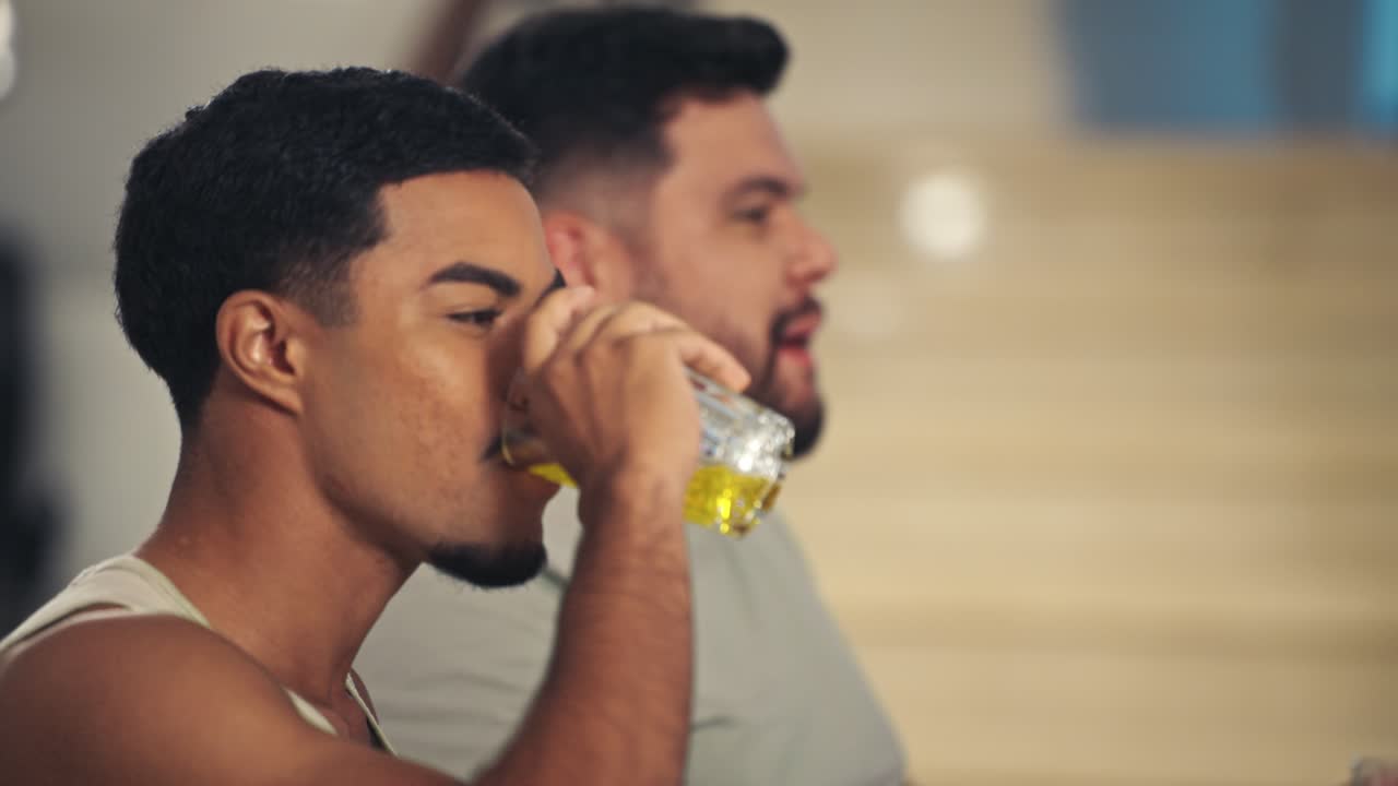 Candid moments of two male friends interacting and laughing indoors