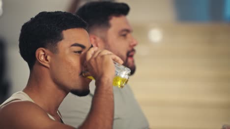 candid moments of two male friends interacting and laughing indoors