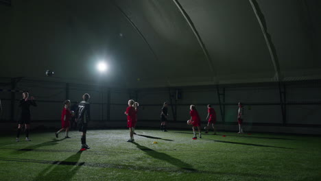 youth soccer team training indoors