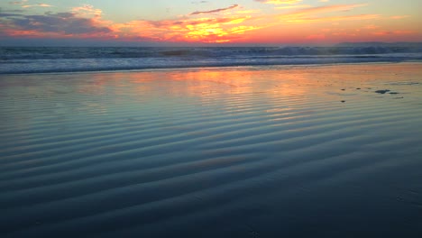 Waves-roll-in-along-a-beautiful-ocean-coast-at-sunset