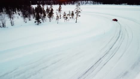 Sports-car-is-driving-on-a-frozen-lake-in-the-arctic-circle