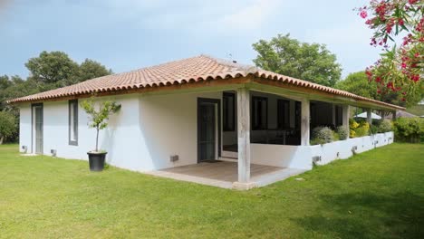 slow establishing shot of a small villa in the countryside of st colombe