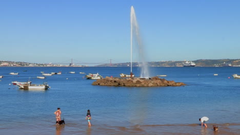 Geiser-de-Oeiras,-in-Paço-de-Arcos,-is-unique-in-Europe-and-the-largest-in-the-Atlantic-Ocean,-surrounded-by-fishing-boats