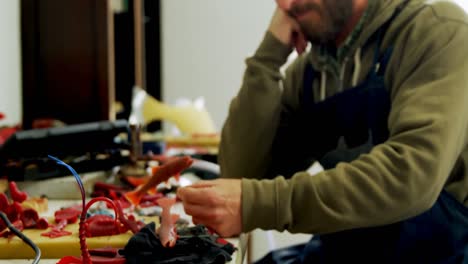 craftsman working on synthetic sculpture 4k