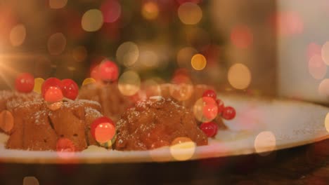 Animation-of-plate-with-christmas-pudding-and-glowing-lights