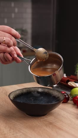 pouring sauce into bowl