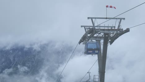 cable cars almost in race against the incoming clouds of white mist