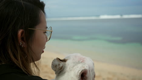 Close--up-Shot-Of-A-Woman-Hugging-And-Kissing-A-French-Bulldog