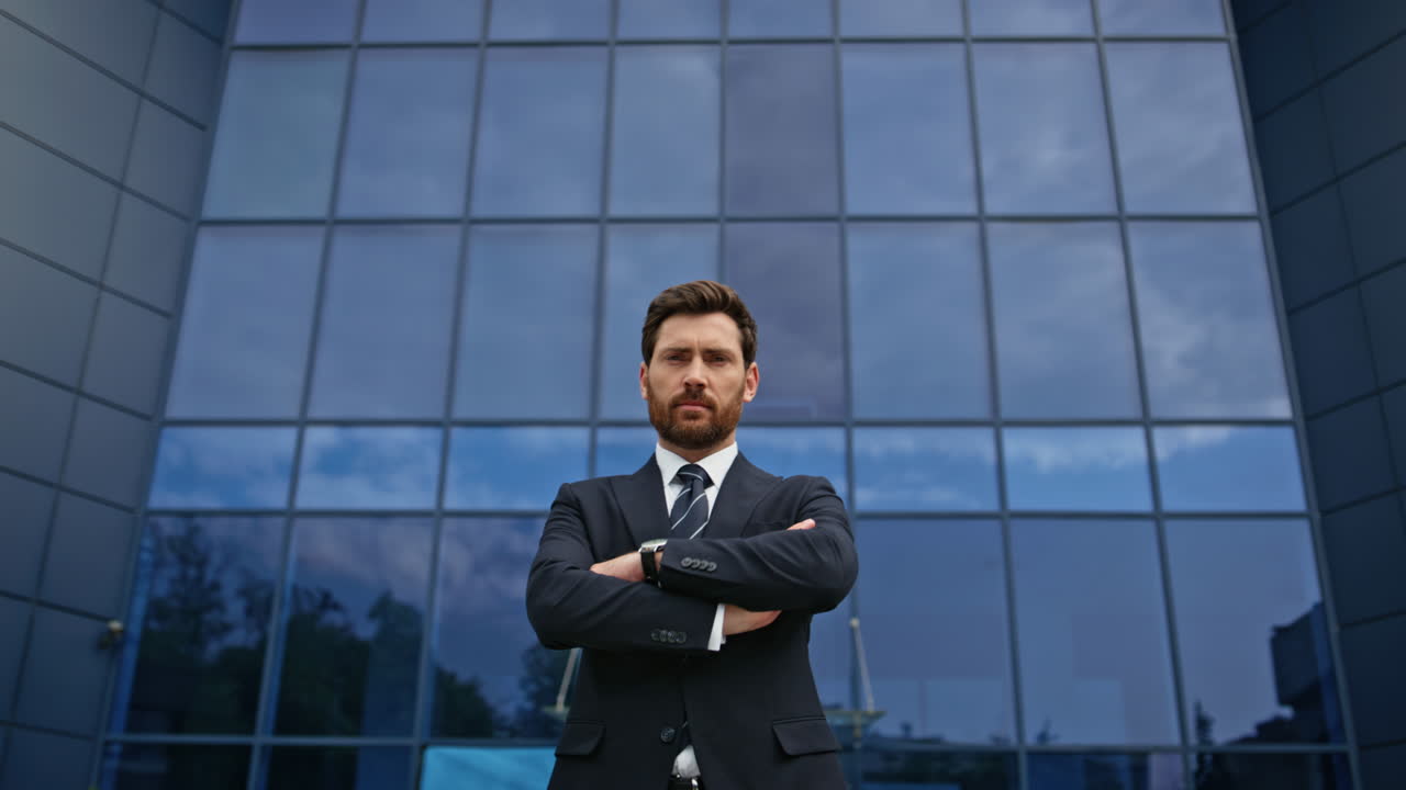 Confident Businessman in Front of Modern Office Building
