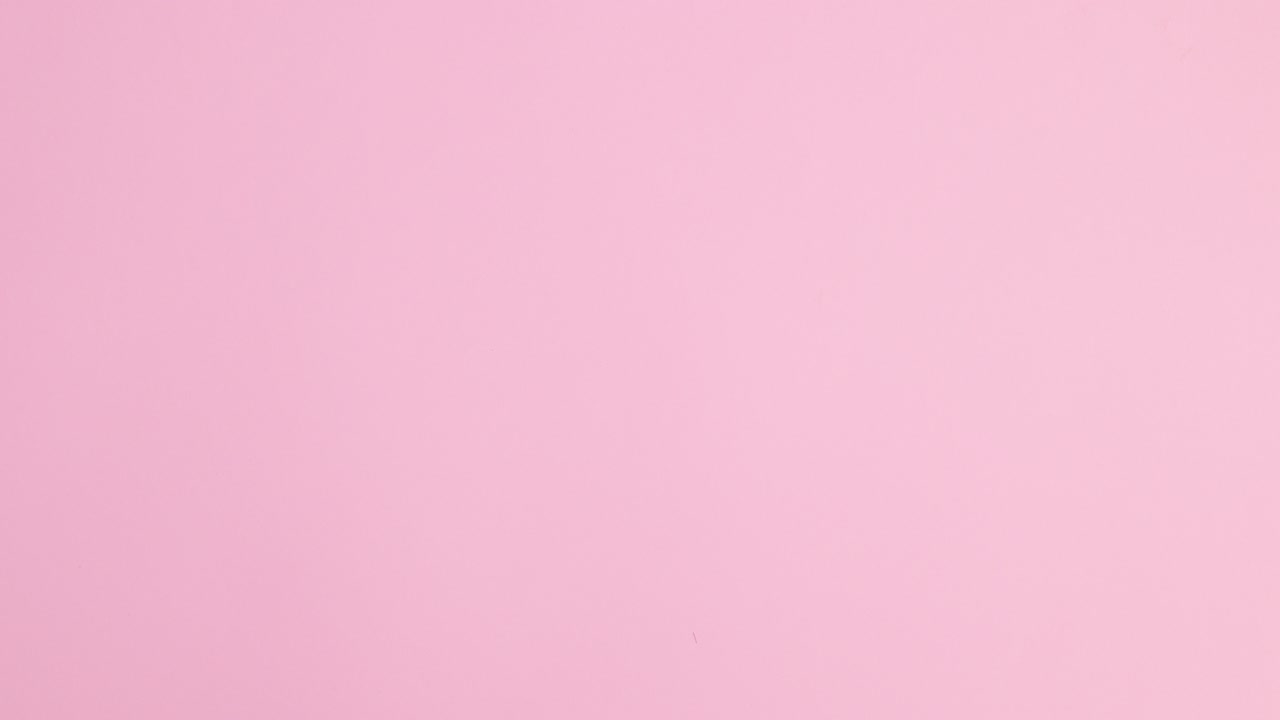 Femininity summer trendy beach accessories appear on pastel pink background. Stop motion