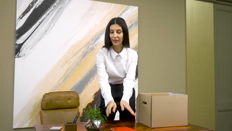 happy female employee packing office stuff and leaving office after resignation 1