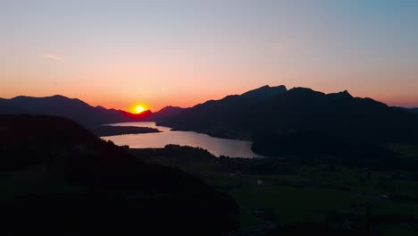 soft sunset glow over lake wolfgangsee and strobl town captured in vibrant evening atmosphere
