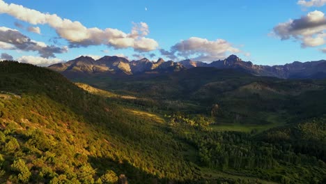 ridgway colorado summer mount sneffels wilderness aerial drone sunset golden hour moon aspen tree forest grove ranch farmland montrose telluride dallas divide san juan rocky mountains backwards pan up