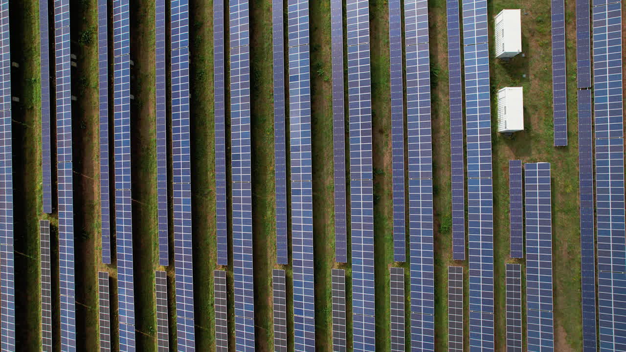 Aerial top view of solar panel rows on the ground in Großenhain, Germany showcasing renewable energy and sustainable technology