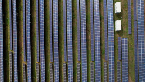 Aerial-top-view-of-solar-panel-rows-on-the-ground-in-Großenhain,-Germany-showcasing-renewable-energy-and-sustainable-technology