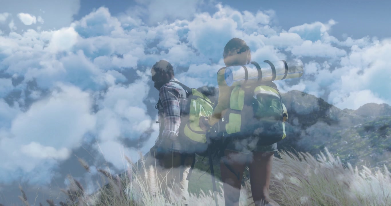 Two hikers trekking uphill on grassy slope, floating route line and pins showing business trends