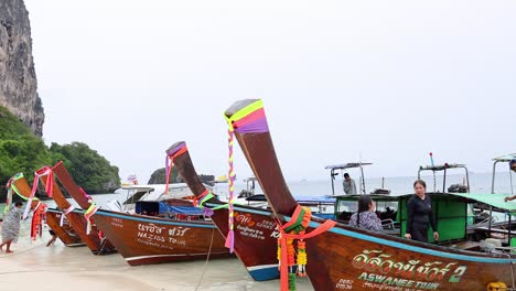 boats docked on a scenic krabi beach