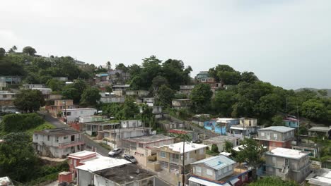 drone shot up hill of puerto rican neighborhood shot in 4k 24p