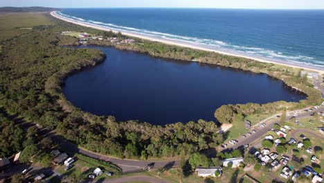 aerial view of lake ainsworth, tea-stained freshwater coastal dune lake in nsw, australia.
