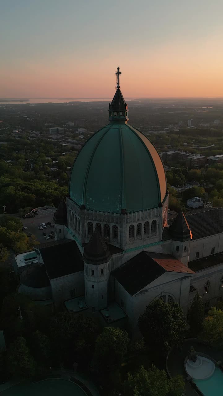 Aerial vertical shot of the Saint Joseph Oratory in Montreal city at sunset with beautiful colors, Quebec province, Canada